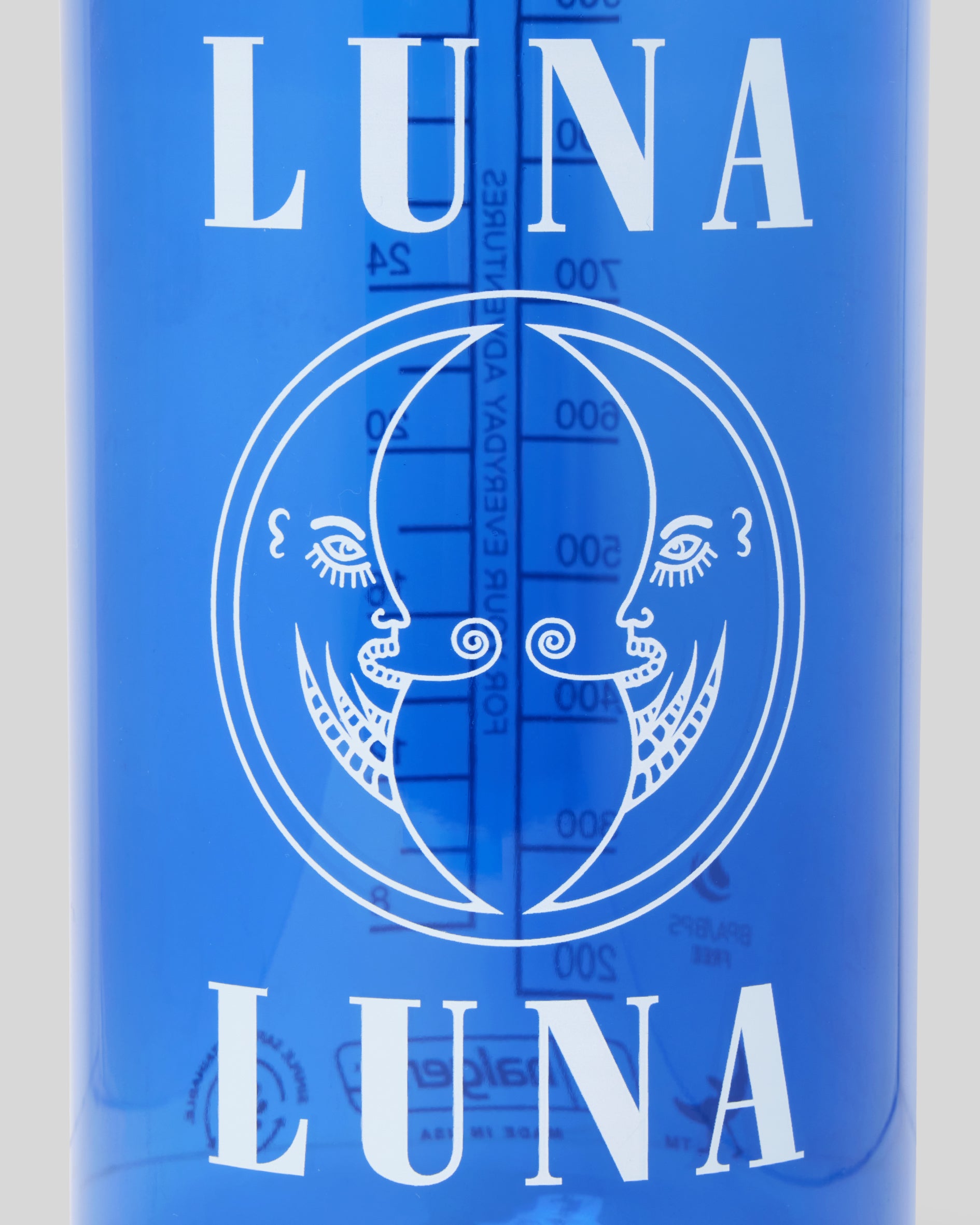 Detail photo of the 1987 Classic Logo Nalgene Water Bottle. Cobalt blue Nalgene water bottle with Luna Luna logo