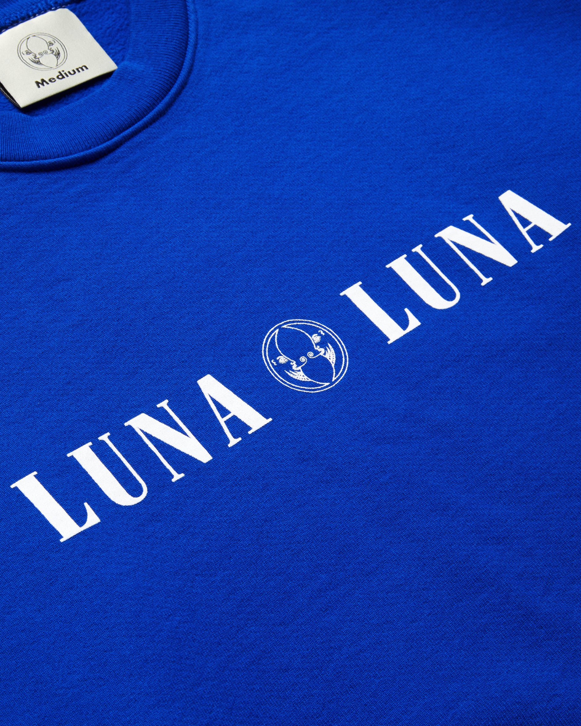 Flat detail photo of the 1987 Logo Crewneck, cobalt blue sweatshirt with Luna Luna logo