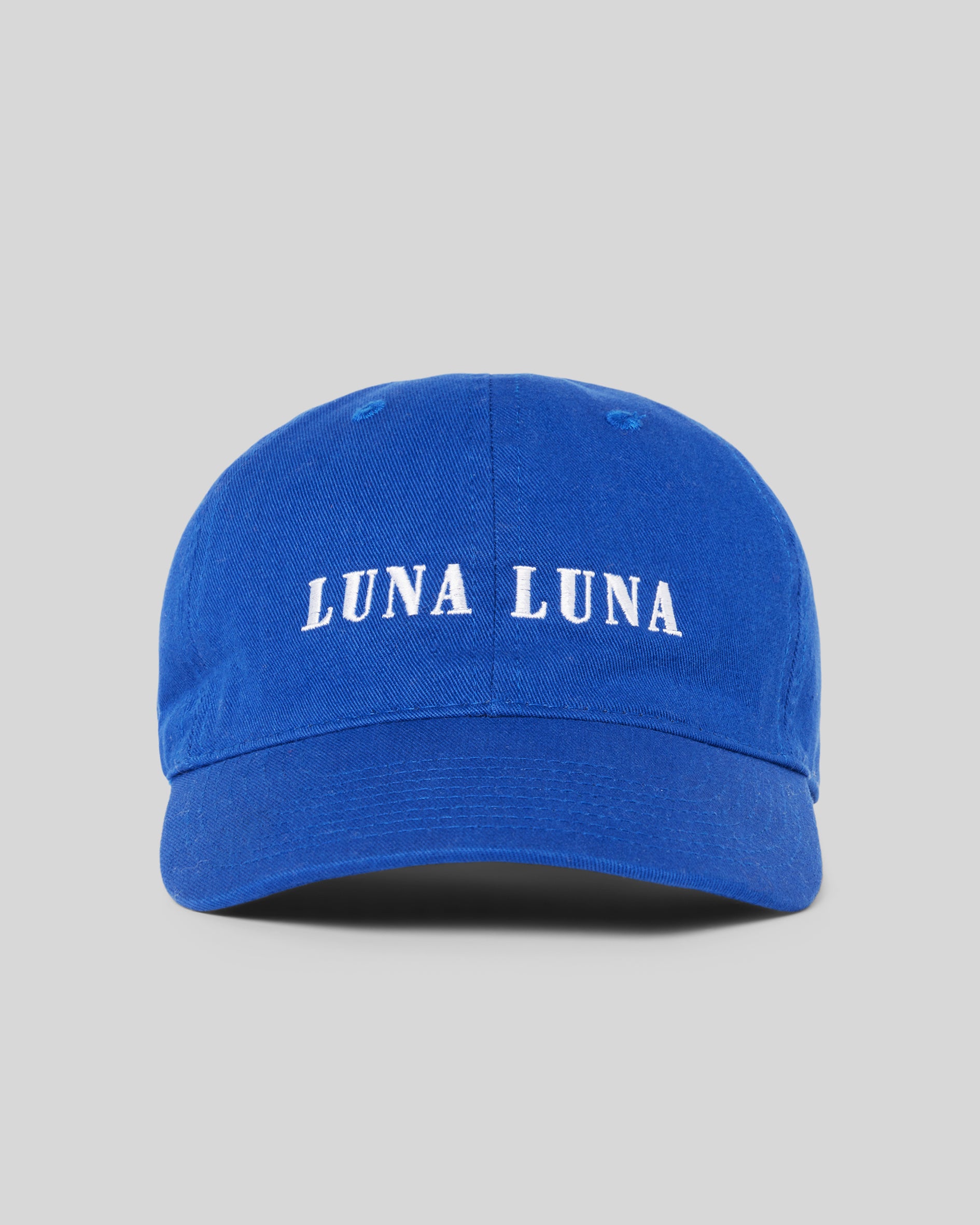 1987 Logo Hat, Cobalt Blue. Cobalt blue baseball hat with white Luna Luna embroidered text at front.
