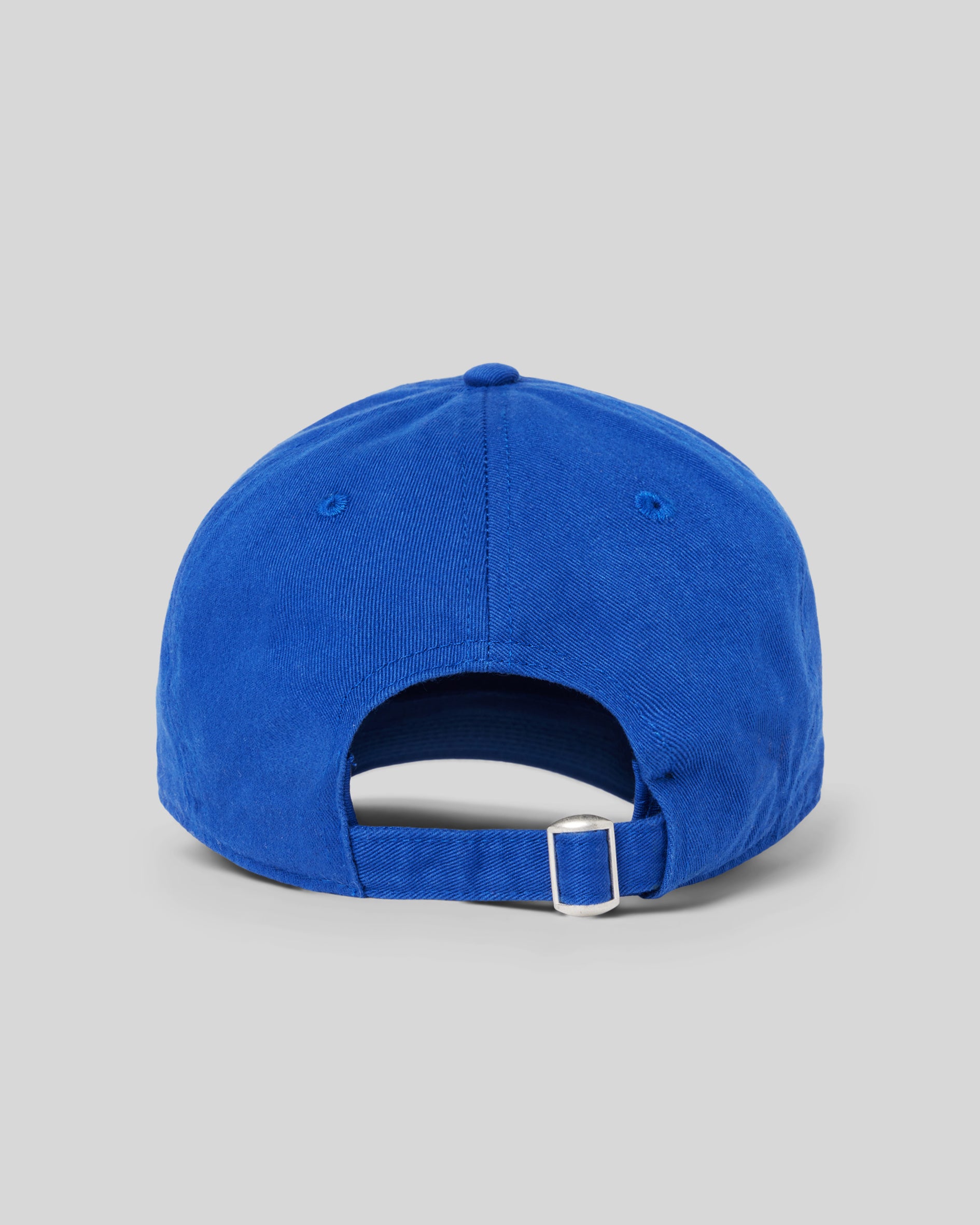 1987 Logo Hat, Cobalt Blue. Rear photograph of cobalt blue baseball hat with white Luna Luna embroidered text at front.