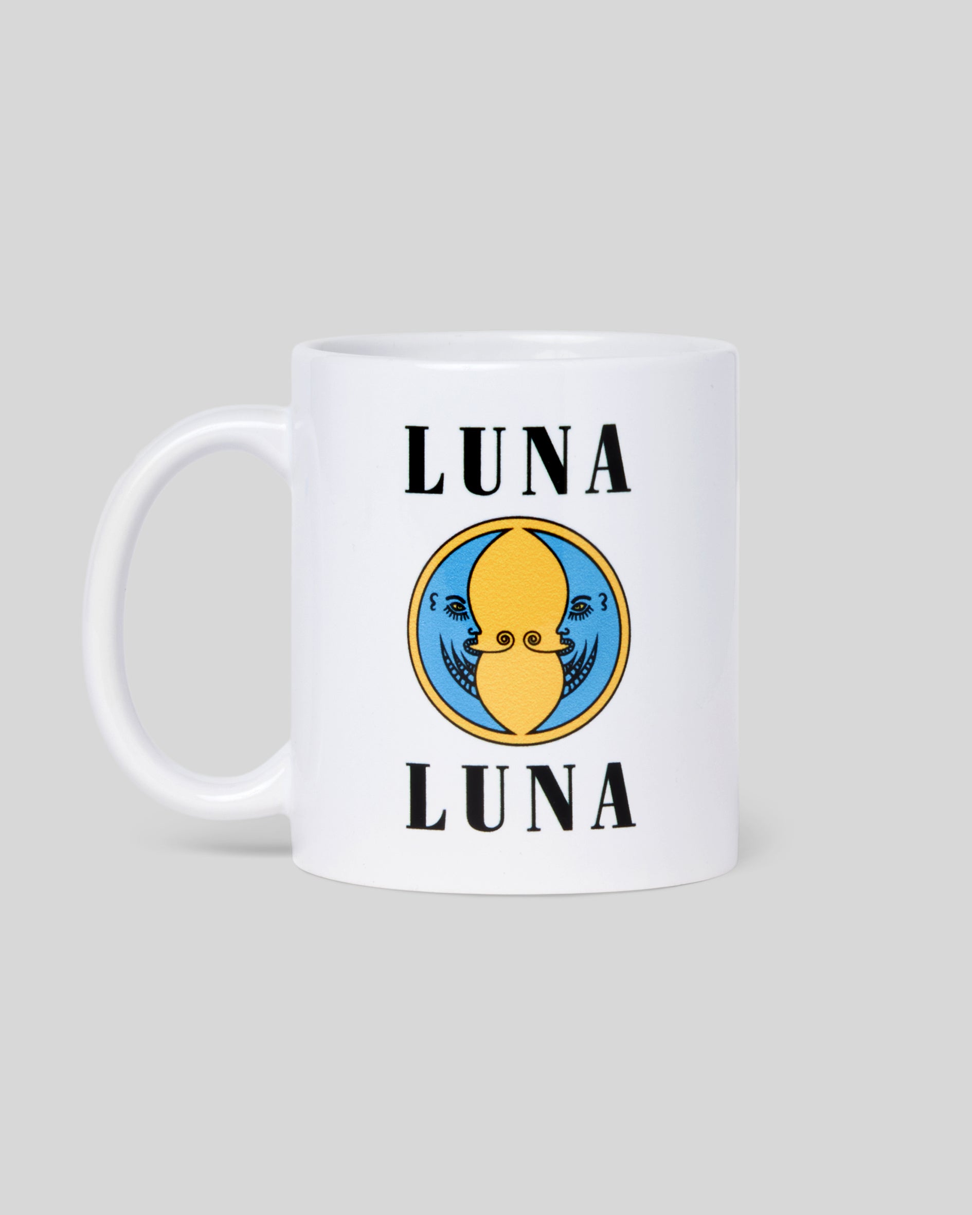 1987 Moon Diner Mug. White coffee mug with black "LUNA LUNA" logo and blue and yellow moon logo.